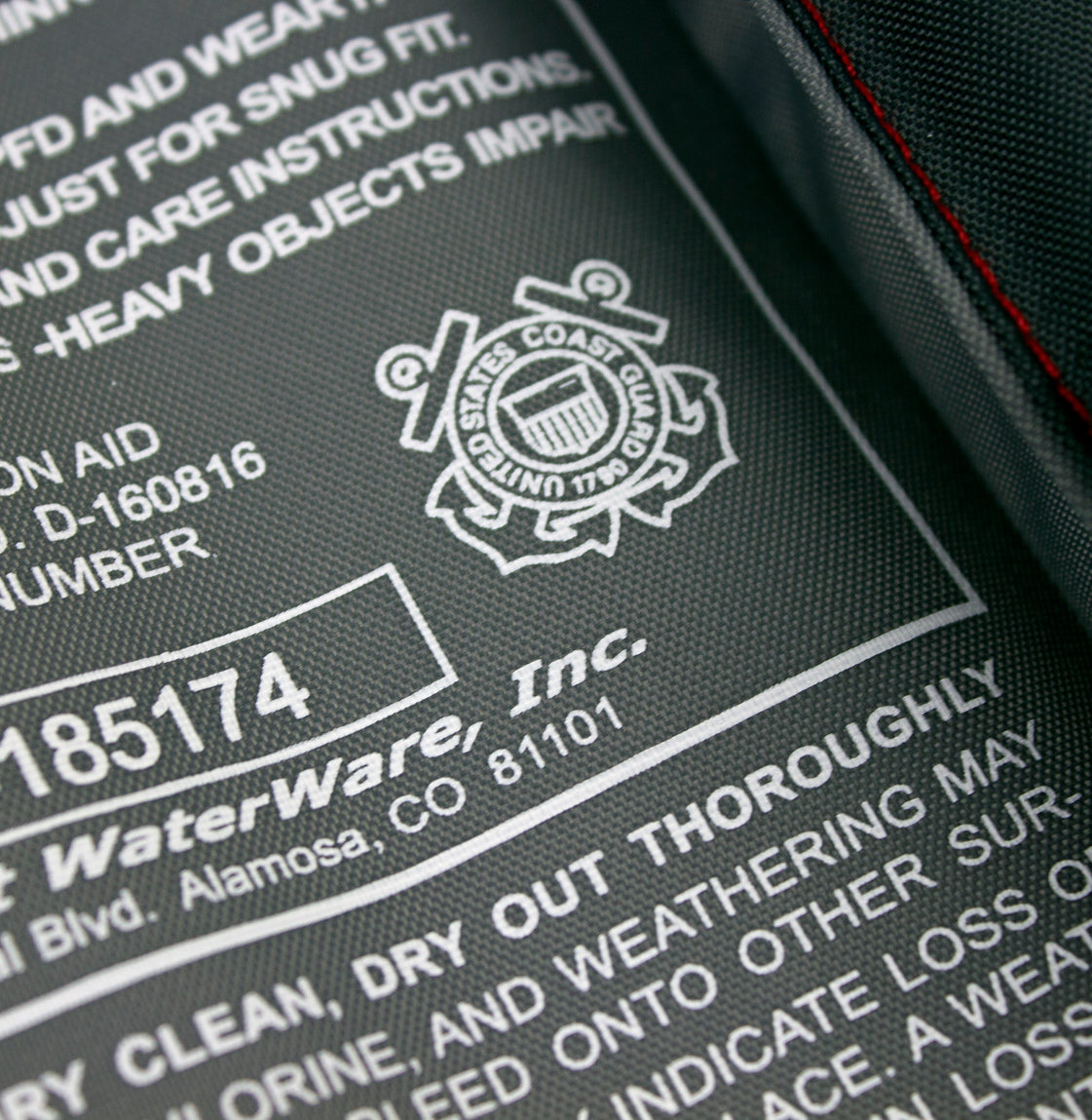 Close-up of Stohlquist US Coast Guard approved kayaking life jacket label