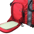 Close-up of red Stohlquist kayaking life jacket with zippered pocket and fishing tool holder